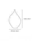 A simple line drawing of a vase-shaped object with dimension labels showing height as 19.6 in / 50 cm and diameter as 13.