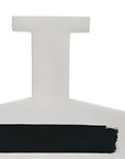 A white ceramic vase with a black painted accent stripe across the bottom, shown against a plain white background.