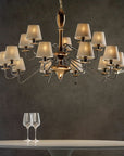 The Lorenzon Divina Chandelier showcases Italian craftsmanship and timeless elegance as it features a glass of wine and a wine glass.