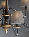 The Lorenzon Divina Chandelier showcases Italian craftsmanship with its metal frame and several shades, exuding timeless elegance.