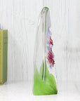 Side View of Maleras Crystal Sculpture Orchid Red on a white background, available at Spacio India from the Sculptures and Art Objects Collection