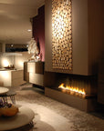 A modern living room with a Planika Bioethanol Fireplace Automatic 3 (FLA3) BEV Technology, ethanol based insert, and automatic burner.