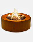 Galio Corten Round gas outdoor  fireplace with flames on a white background from Planika, available at Spacio retail stores in Mumbai & Kolkata.