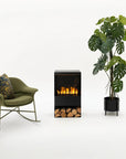 Green armchair with decorative pillows, small artificial water vapour electric fireplace, and potted plant on a white background