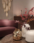 A living room with elegant furniture, including a Meystyle Dolomite LED Wall Paper couch and two exquisite vases.