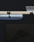 A contemporary Italamp Axi chandelier with a glass rod hanging from it, illuminated by an LED light source.