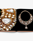 A necklace. Beyond Extravagance coffee table book by Assouline, featuring the Al Thani Collection of Indian royal jewels and artefacts, spanning 400 years of history.