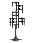 A black metal wall-mounted candelabra with a sculptural, geometric design featuring spherical and cylindrical elements on a solid white background.