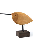 A Warm Nordic Beak Bird Awake Snipe Oak figurine resting on a wooden base in true Scandinavian aesthetics.