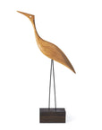 A Warm Nordic Beak Bird Tall Heron Oak sculpture of a heron figurine standing on a wooden base.
