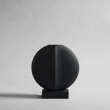 A 101Cph Guggenheim Mini Black 111126 by 101 Copenhagen on a white background that adds a whimsical touch to any interior setting.