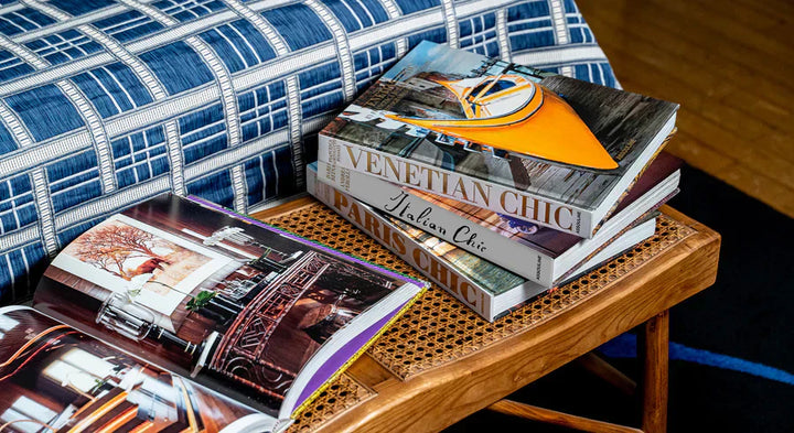 Assouline coffee table books styled on an ottoman 
