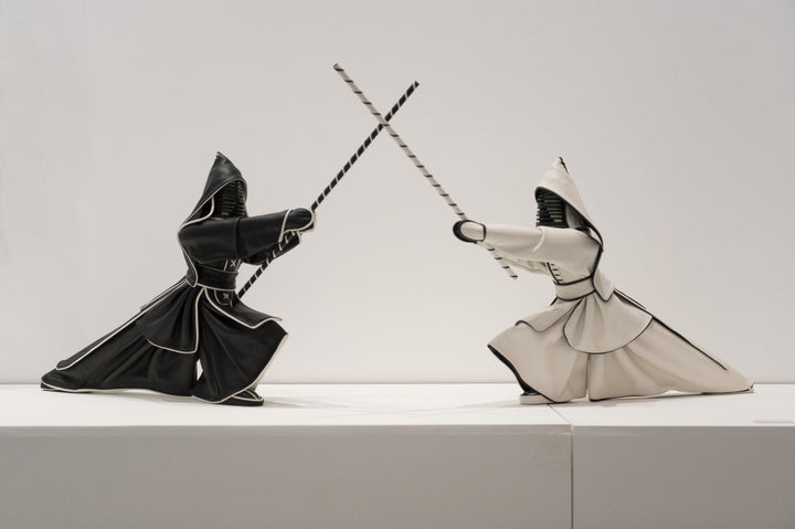 Annie Delemarle Kendo Black and White Leather Sculptures styled on a white console table available at spacio india online and retail stores