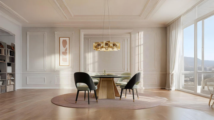 Elegant neoclassical dining room styled with soft pastel chairs, geometric wood table, and a bold gold chandelier from Spacio India.