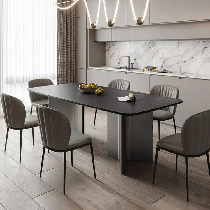  Luxury marble-top dining table with sculptural gold base and cream upholstered chairs, available at Spacio Kolkata stores in India.