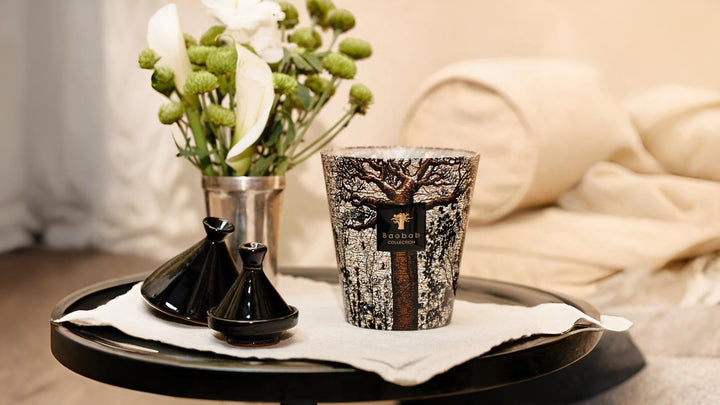 Baobab scented candle styled on a tray in a luxury living room