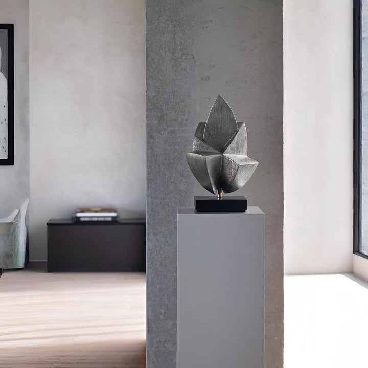 Contemporary metal lotus-inspired sculpture from Gardeco displayed on a pedestal – perfect for gallery-style entrance foyer or luxury living room styling.