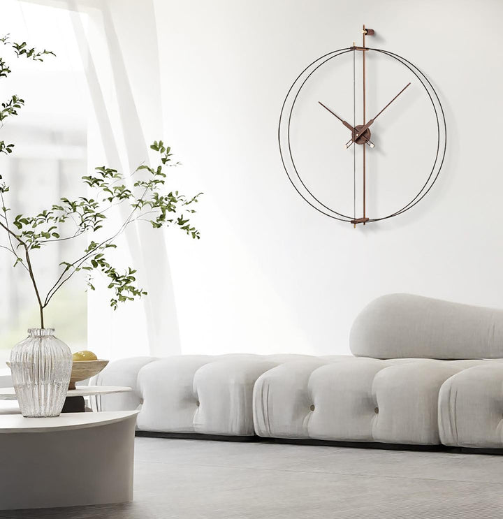 Modern Hyderabad living room showcasing the 2025 decor trend of refined minimalism with a striking circular wall clock and a modular B&B Italia sofa, reflecting global design influences in luxury home interiors.