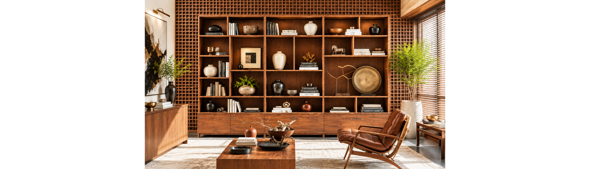 Bookshelf styled with luxury artefacts, sculptures, books, vases and decor accessories