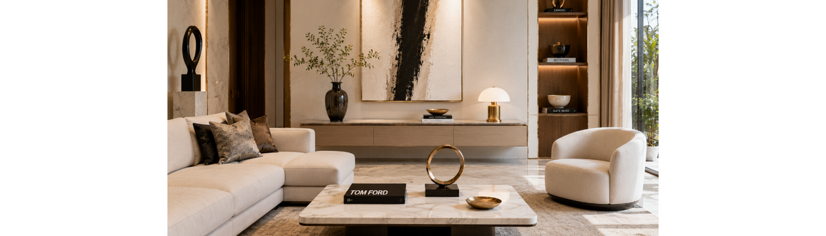 Luxury living room styled with sculptural decorative objects, coffee table books and a marble coffee table