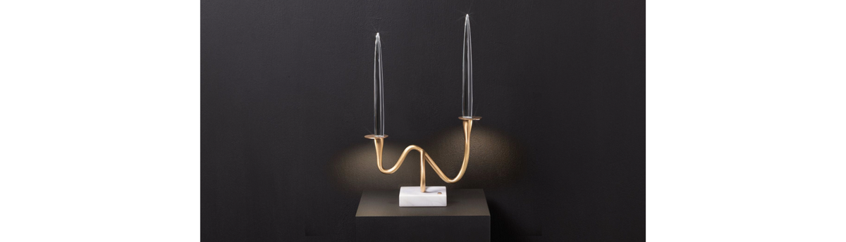 Il Pezzo 3 Bugia sculptural candle holder by Il Pezzo Mancante featuring hand-finished brass arms with crystal candle holders on a marble base.