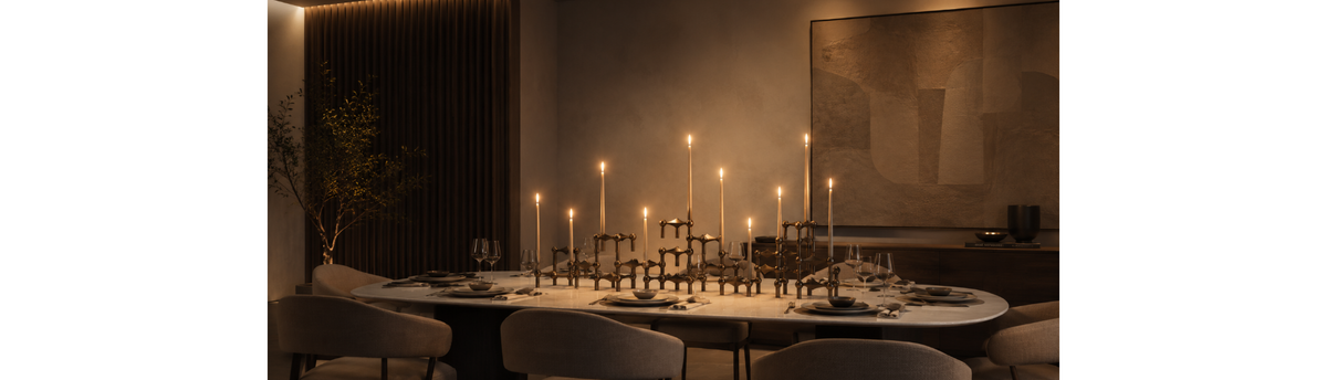 Luxury dining table with a large candlebra setting and taper candles styled by Navin Kanodia of Spacio