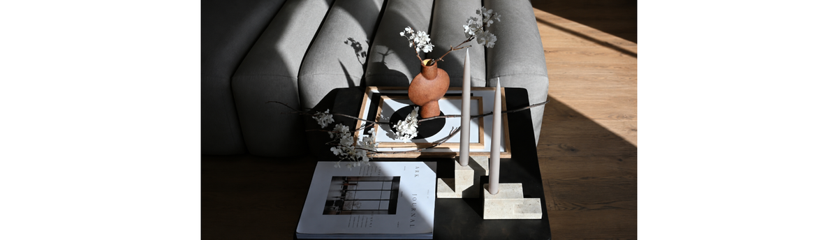 Scandinavian Japandi-inspired styling with sculptural ceramics and minimalist decor in a modern luxury interior