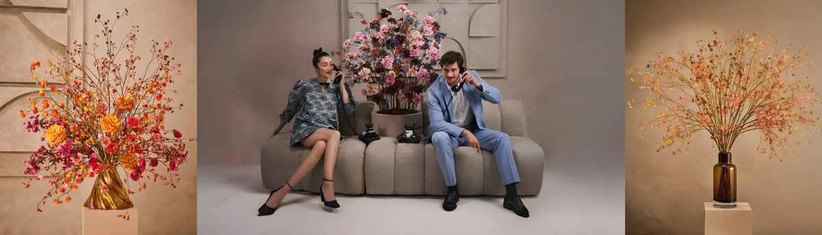 Collage of decoration and mood shots with artificial flowers, leaves available at Spacio from Silk-ka and a couple sitting on a sofa