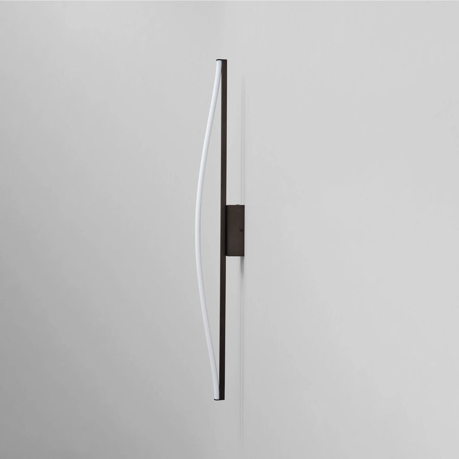 Modern wall light fixture on a gray background by 101 Copenhagen available at Spacio retail stores in Mumbai & Kolkata