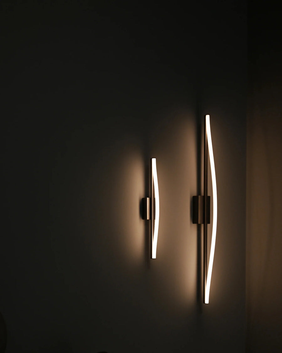 Modern wall sconces on a dark wall