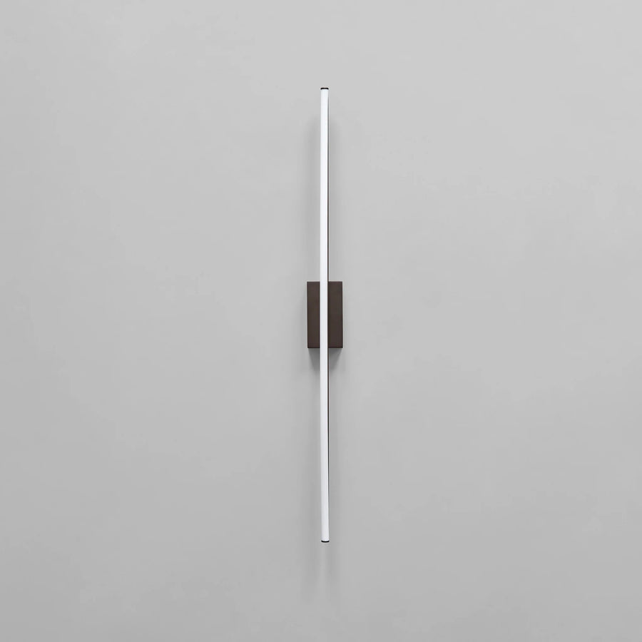 Modern wall-mounted light fixture on a gray background