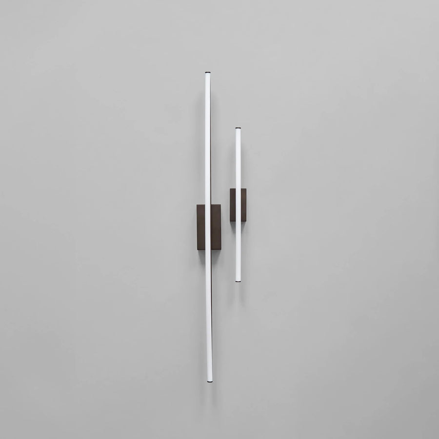 Two modern wall lights on a gray background