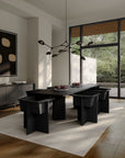 A Scandinavian theme dining room styled with wall art, sculptural vases , bowl, wall art and a minimal design chandelier. 