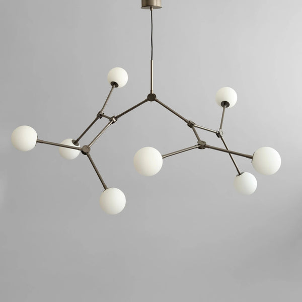 Modern chandelier with white spherical lights on a gray background