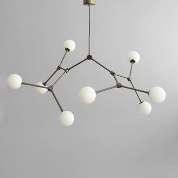 Modern chandelier with white spherical lights on a gray background