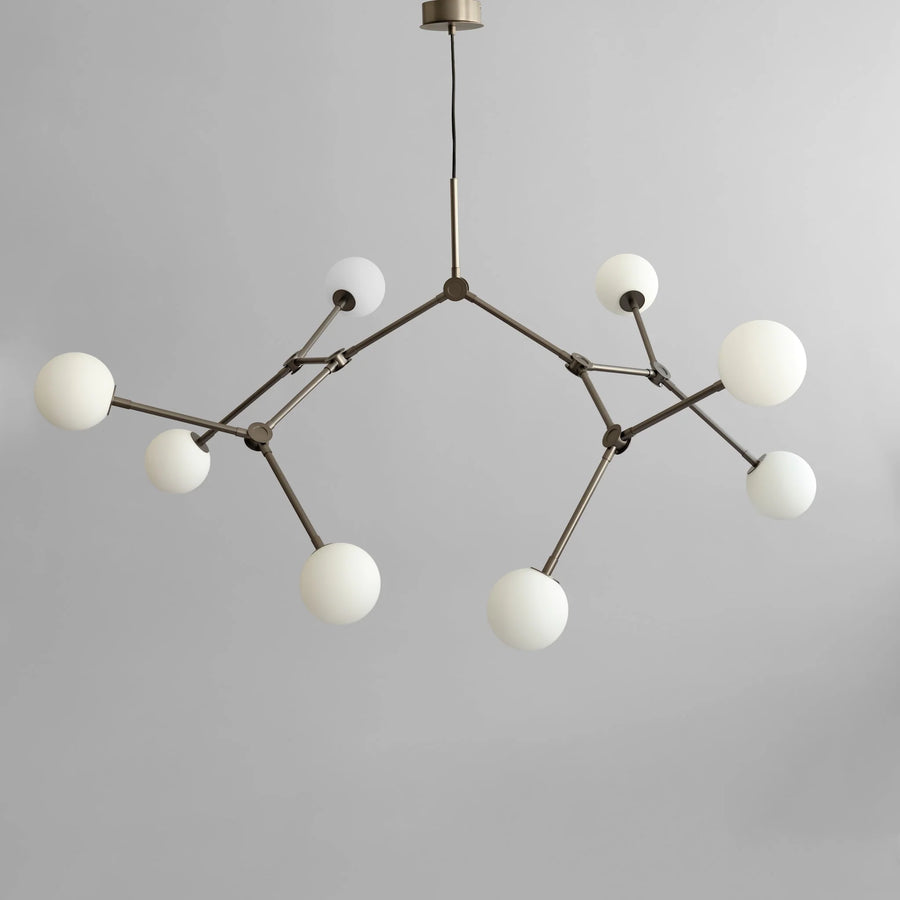 Modern chandelier with white spherical lights on a gray background