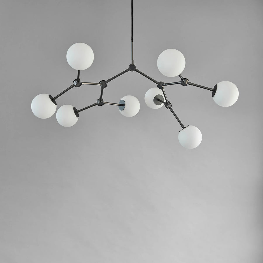 Modern chandelier with white spherical lights on a grey background from 101 Copenhagen available at Spacio retail stores in Mumbai & Kolkat.a 