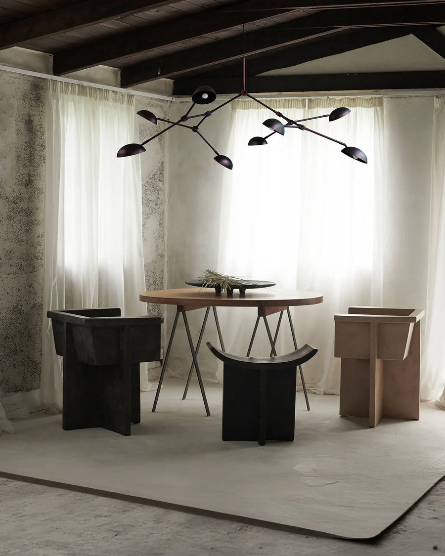 A Scandinavian theme dining room styled with bowl,and a minimal design chandelier. 