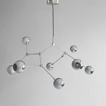 Modern chandelier with geometric design on a gray background from 101 Copenhagen available at Spacio retail stores in Mumbai & Kolkata. 