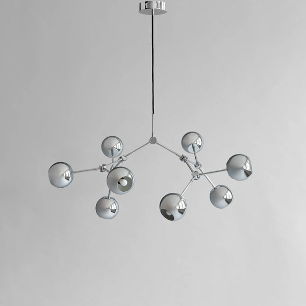Modern chandelier with multiple spherical lights on a gray background from 101 Copenhagen available at Spacio retail stores in Mumbai & Kolkata. 