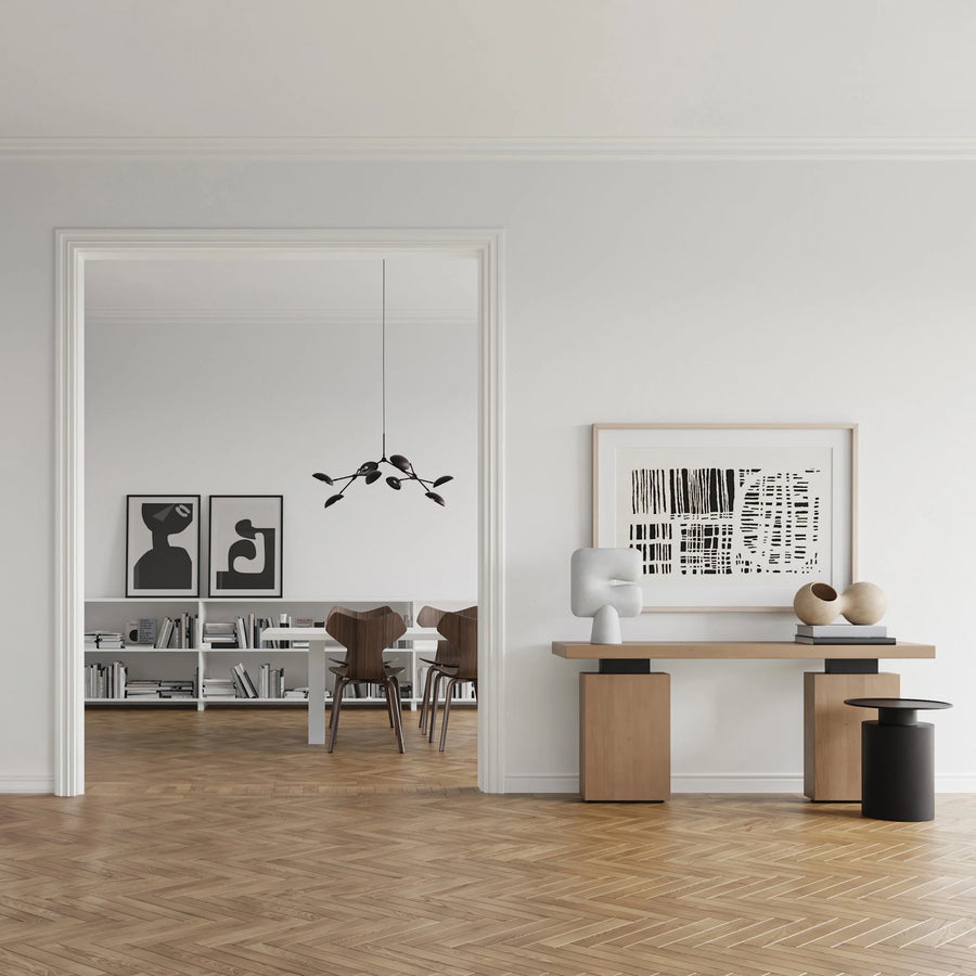 A Scandinavian theme ineriors styled with wall art, sculptural vases , bowl, wall art and a minimal design chandelier. 