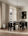 A Scandinavian theme dining room styled with wall art, sculptural vases , bowl and a minimal design chandelier. 