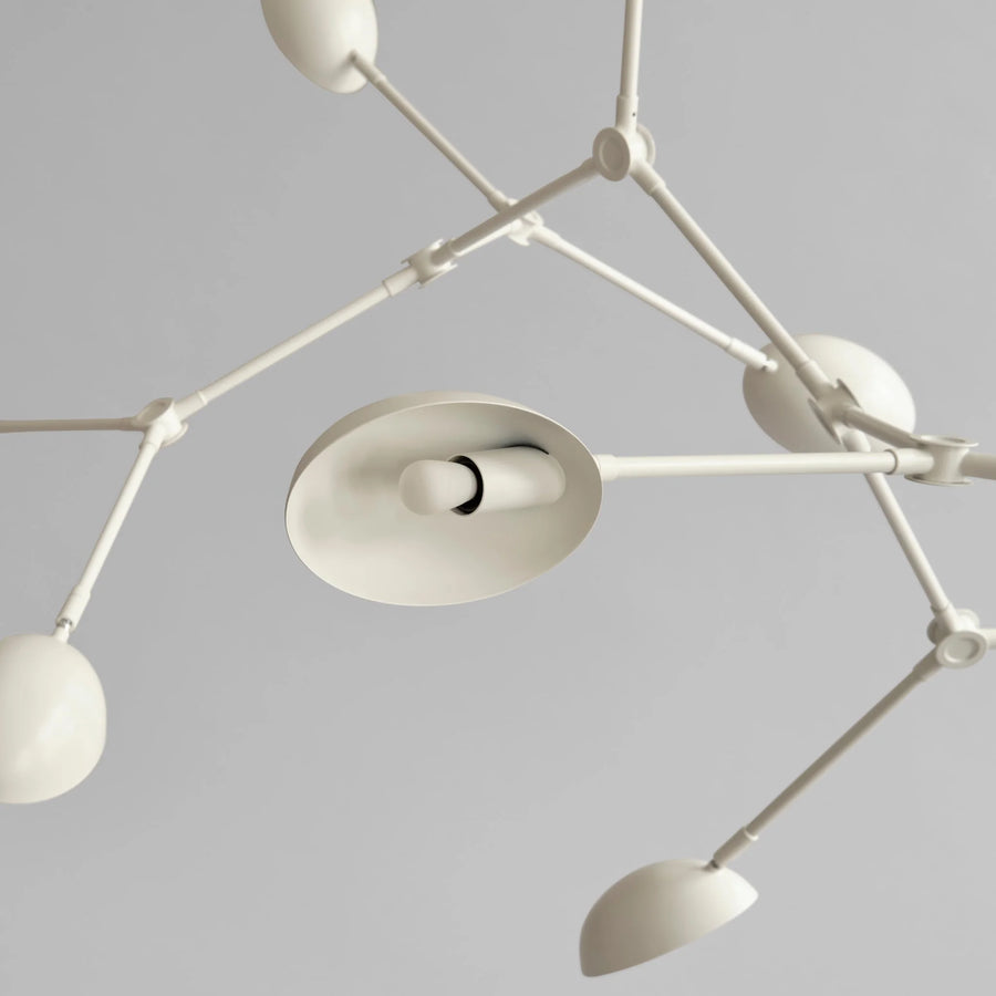 Close up of a white finish Drop chandelier from 101 Copenhagen available at Spacio retail stores in Mumbai & Kolkata. 