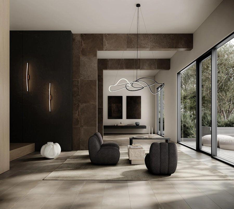 Modern living room with gray sofa, coffee table, and decorative items.