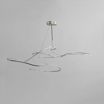Modern pendant light with wavy design on a gray background