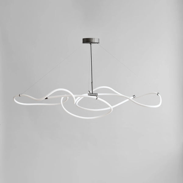 Modern pendant light with white curved arms on a gray background