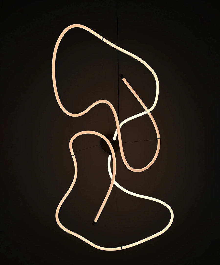 Neon light sculpture on a black background