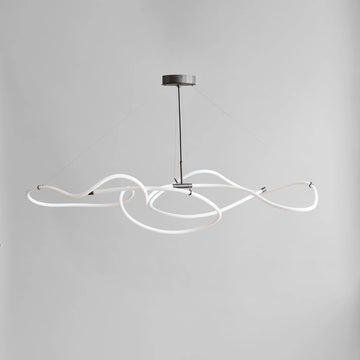 Modern pendant light with white curved arms on a gray background