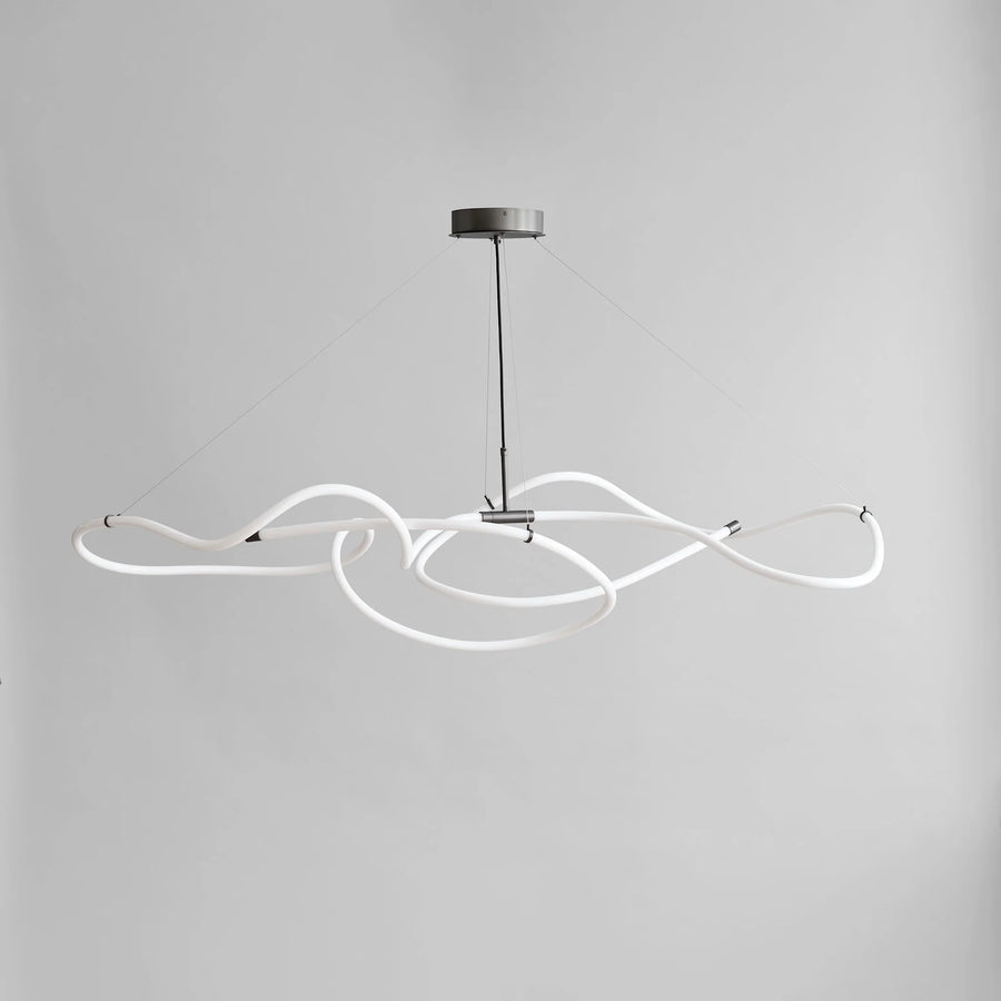 Modern pendant light with white curved arms on a gray background