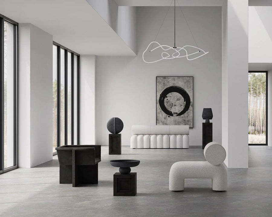 Modern interior design with white furniture and black accents